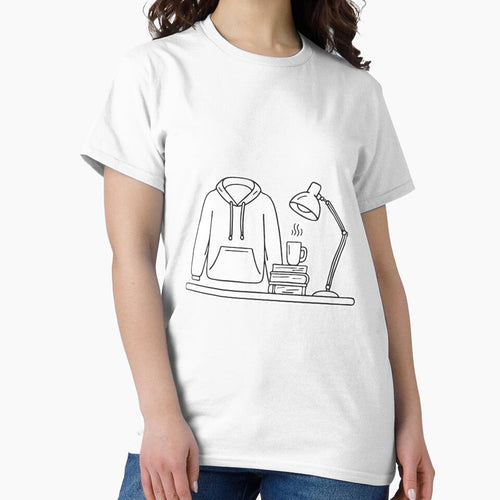 A folded university hoodie placed beside a desk lamp by rasagamastore